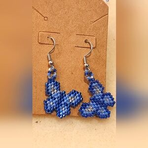 These are handmade beaded small fish hook lightweight butterfly shaped earrings.